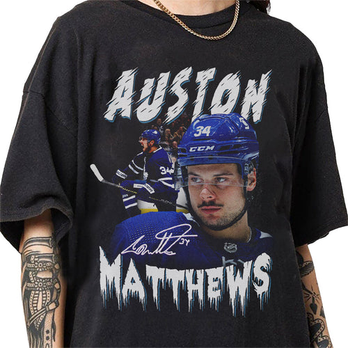 a man wearing a black shirt with a picture of a hockey player on it