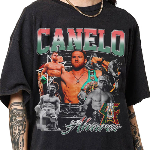 a man wearing a black shirt with a picture of a wrestler on it